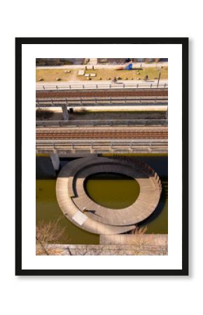 Minimalist circular walkway and water structure viewed from above, ideal for urban design concepts, background space and modern architecture with clear geometry and calm tones