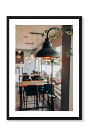 Warm Industrial Lamp in Cozy Modern Cafe Interior