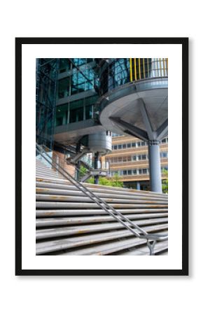 Architecture with stairs and staircase exposes structure where geometry and design dominate, relying on minimalism to sharpen architectural detail set against urban space and modern building