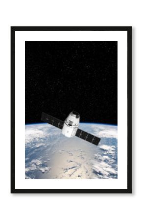 Cargo space craft and Earth planet. Dark background. Sci-fi wallpaper.Space Station Orbiting Earth.Space ship. Space art wallpaper.Solar Observatory.Elements of this image furnished by NASA.