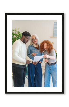 Diverse Business Group Review of Documents In The Office.