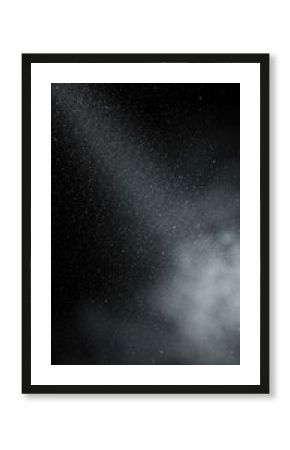 A monochrome, abstract view of fine particles akin to stars, with a soft, ethereal cloud emerging from the bottom