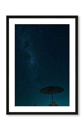 The Milky Way Galaxy Visible in the Night Sky Above a Silhouetted Shelter