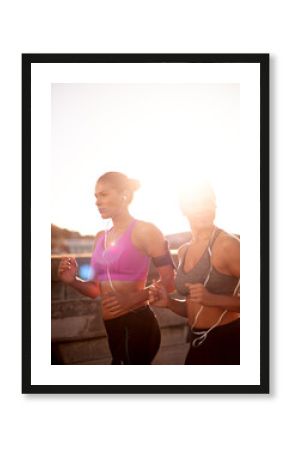Friends, women and running with music outdoor for cardio workout, endurance challenge and listening to radio. Mockup, flare or people with teamwork for fitness jog, sport training or healthy exercise