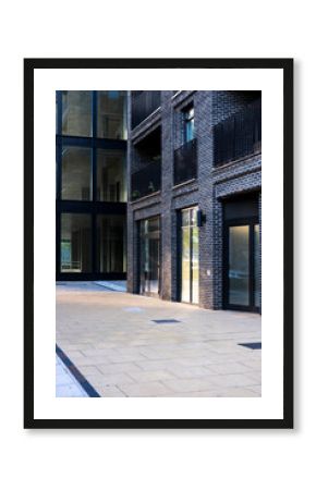 Clean sidewalk in a modern district, emphasizing space and geometric forms.