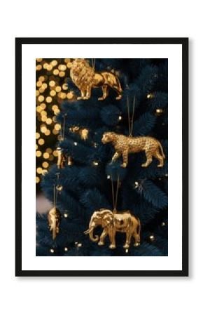 Golden safari animal ornaments on Christmas tree 