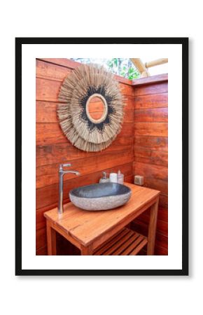 Luxury safari camp bathroom in the middle of the bush in Southern Africa. The bright white interiors are very modern and the tent exterior is dated. These are glamping pods.