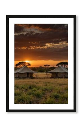 Beautiful sunset over safari tents in the African savannah.