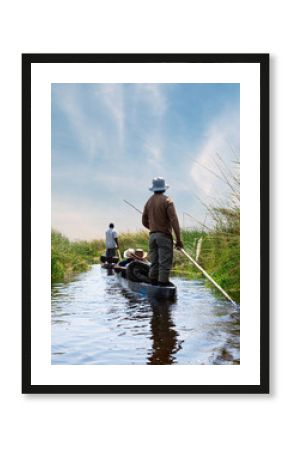 Boat trip in a traditional Makoro at the Okavango Delta, Botswana