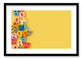 Colorful letters of the alphabet on yellow background. Primary school or preschool, kindergarten. Educational game. Learning through play.