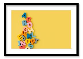 Colorful letters of the alphabet on yellow background. Primary school or preschool, kindergarten. Educational game. Learning through play.