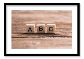 wooden elements with the letters collected in the word abc