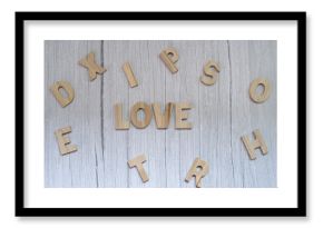 Overhead view of the word love made from wooden letters on a wooden table