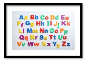 Plastic magnetic letters isolated on white, top view. Alphabetical order