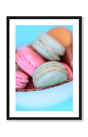 Cake macaron or macaroon on turquoise background