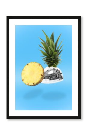 Disco ball fruit with green leaves and piece of pineapple on blue background