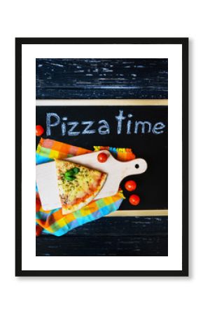 Above view of piece of pizza, tomatoes on wooden desk on blackboard and black wooden background with drawing products and vegetable.