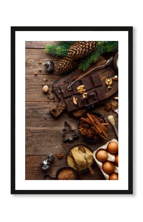 Christmas or new year culinary rustic wooden background with food ingredients for cooking festive dishes, xmas baking. Holiday cooking frame for Noel pastry on wooden table