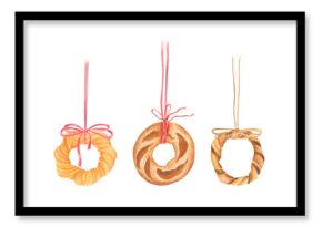Watercolor illustration of three ring-shaped baked goods hanging on ribbons with bows: loaf of bread, bagel, and sweet pastry. Cozy food design for bakeries, packaging, posters, or seasonal decor.