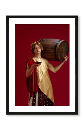 Young man in ancient toga carrying large wooden barrel and holding wine glass. Concept of winery branding, beverage advertising, lifestyle promotion, and creative restaurant campaigns.