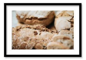 Assorted homemade bread on white clean wood background.Fresh tasty bread.Bakery - rustic crusty loaves of bread and buns.Homemade natural breads. Different kinds of fresh bread as background