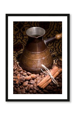 Metal turk and coffee cup on a dark background