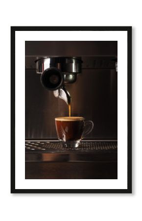 Hot coffee flow to a cup on espresso machine
