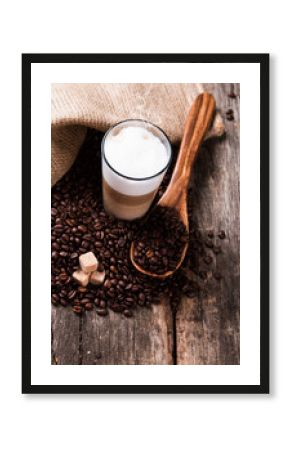 Coffee on a wooden table. Dark background.