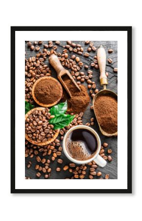 Roasted coffee beans, ground coffee and cup of coffee on wooden table.