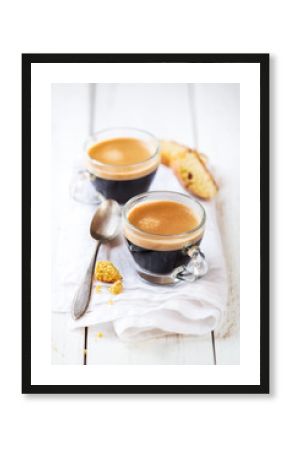 Good morning concept - Two cups of espresso coffee for breakfast on a white napkin against white rustic wooden background