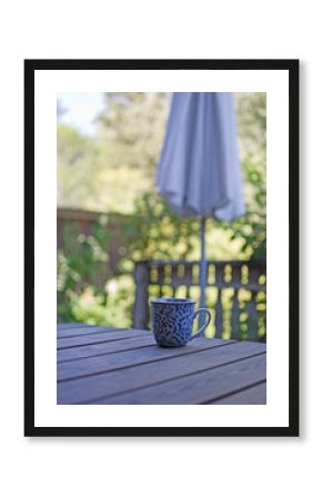 Mug in blue pattern on wooden table