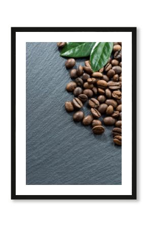 coffee beans and leaves on a dark background, space for text, vertical