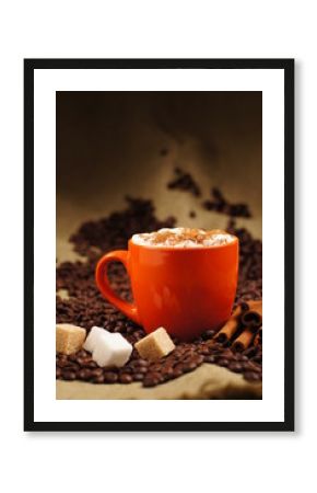 orange cup with hot cuppuccino