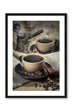 Two cups of coffee with spices and old cezve