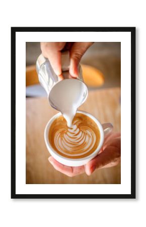 Cup of coffee latte in coffee shop.