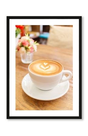 Cup of coffee latte art on wood table