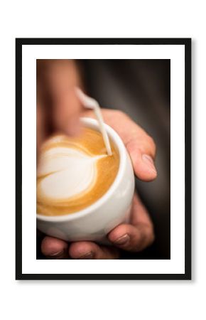 Coffee with heart shape latte art serve in white cup