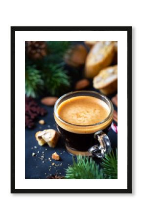 Christmas morning concept with espresso coffee, almond cantuccini biscuits and festive decorations
