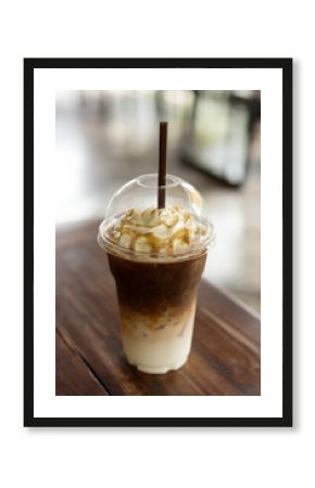 Iced coffee with caramel syrup and whipped cream