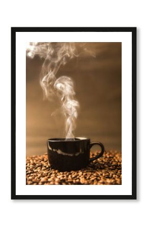 still life of warm black cup of coffee on  roasted coffee beans