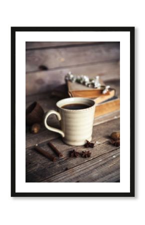 Large Cup of coffee on vintage wooden background. Spring flowers and books.