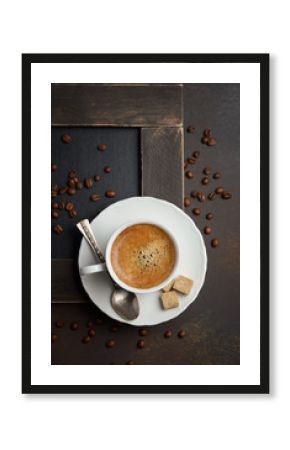 Cup of fresh coffee on dark background, top view