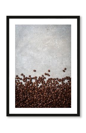 Roasted coffee beans on gray stone background. Close up