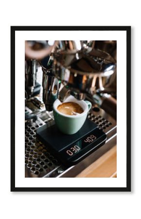 VORONEZH/RUSSIA-02.20.2018: delicious fresh morning cappuccino coffee with a latte art on its foam, standing on a Rocket r58 v2 espresso machine’s metal drip tray