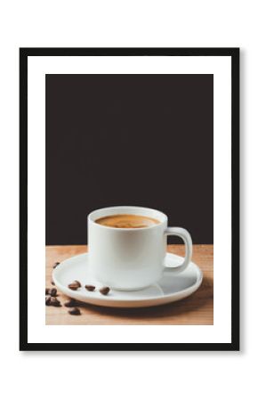 Espresso coffee cup on wooden table and dark background