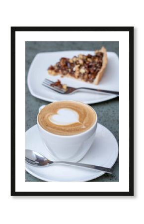 Cup of latte coffee with cake, closeup