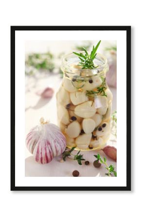 Pickled garlic with spices and herbs