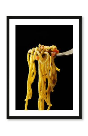 Italian pasta spaghetti on fork on black background