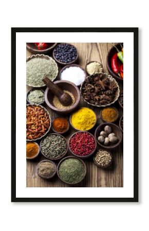 Assortment of spices in wooden bowl background 