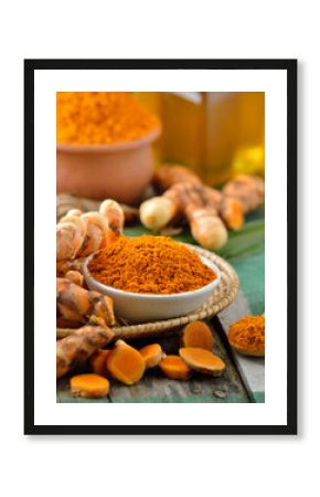  turmeric roots in the basket on wooden table